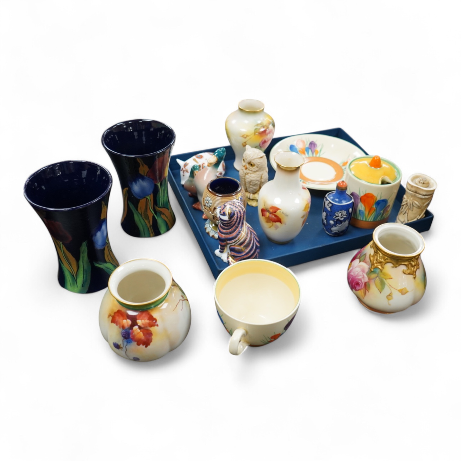 A collection of mixed porcelain and pottery to include four Worcester vases, one signed H. Blake, Clarice Cliff crocus pattern cup, saucer and sugar bowl and two Doulton Imari paperweights, largest 13cm high